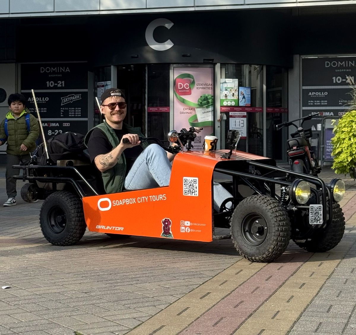 A smiling rider at the wheel in Riga